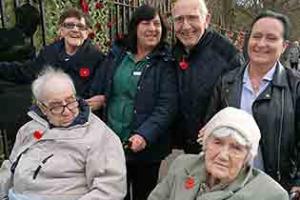 (back, from left) Mandale House Care Home carer Jackie Drinkel, resident Peter Wilson, domestic worker Lorrain Whitehead, resident May Small and (seated, from left) residents Irene Fleming and Billy James attend the Remembrance Day service at Thornaby War Memorial.