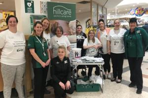 Care home staff packing shopping for children’s cancer charity