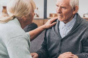 Old lady looking after man with dementia