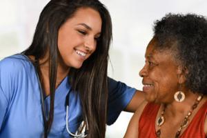 Nurse with patient thinking about career in care