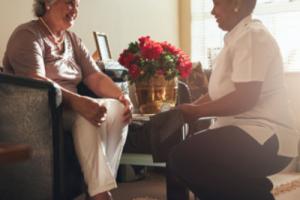 CQC outstanding - Care worker with a resident