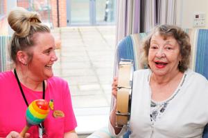 Laughing resident with good mental health in care home